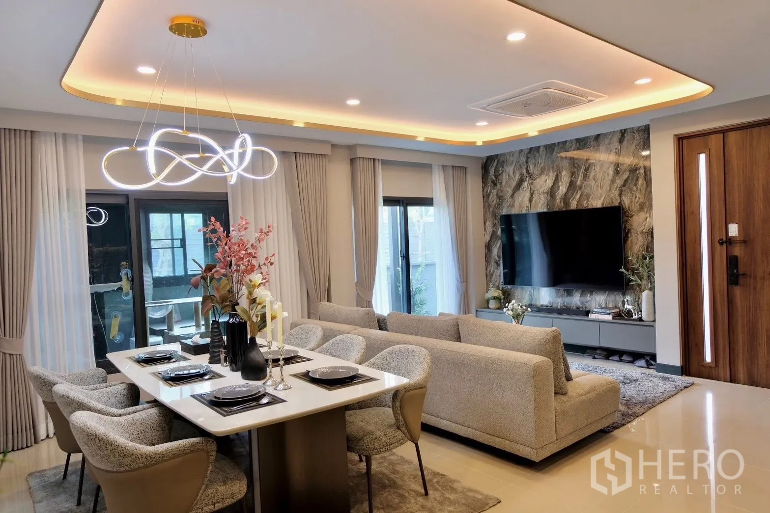 Semi-detached House for sale in Prawet, Bangkok - Bedroom with upholstered bed opening to a dressing area.