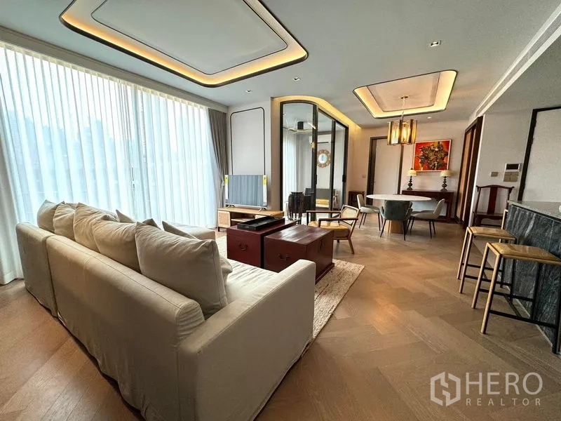 Condominium for rent in Watthana, Bangkok - Bright lounge with large windows, cove ceilings and wood flooring.
