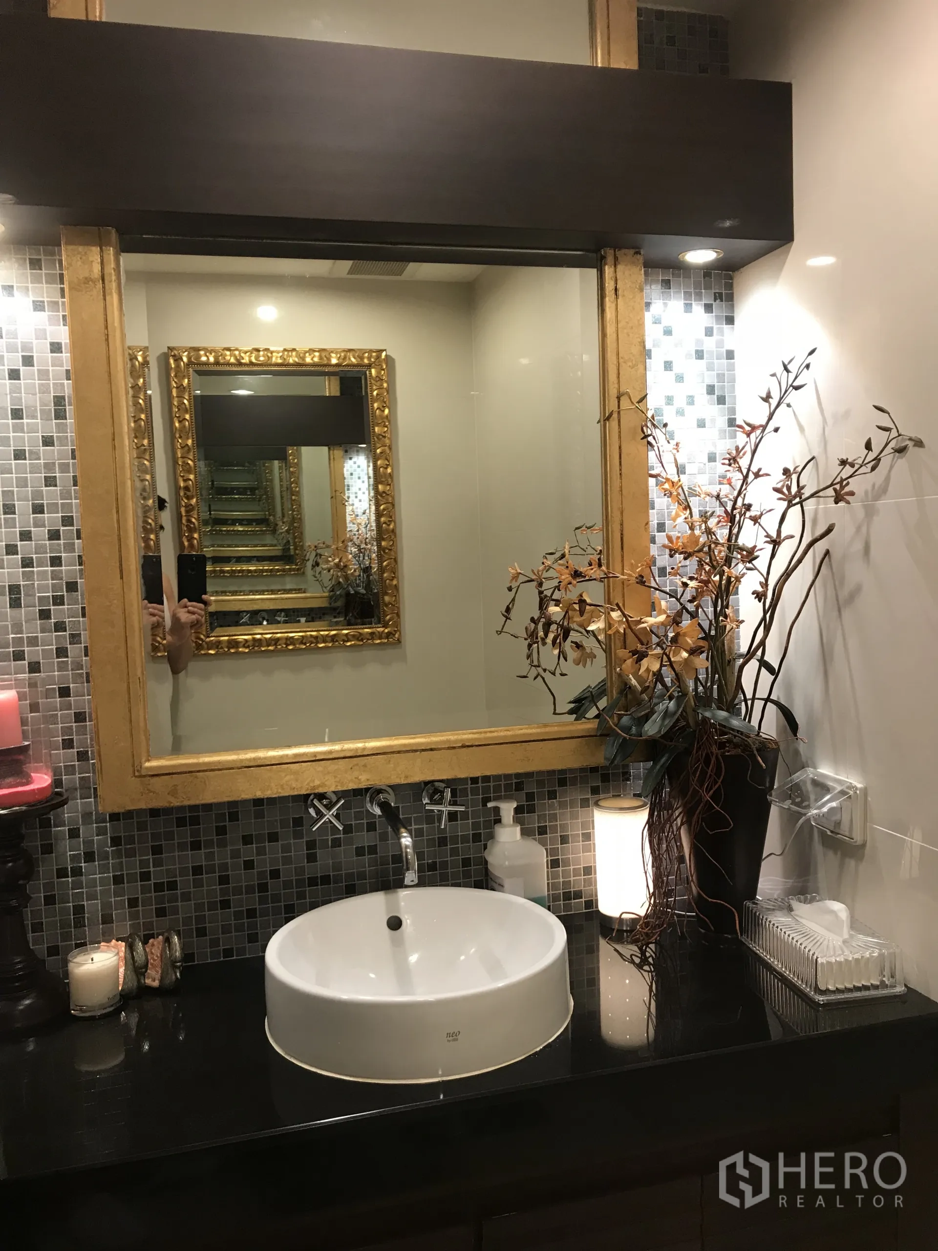 Condominium for sale in Yan Nawa, Bangkok - Stylish powder room with round basin, gold-framed mirror and mosaic tile backsplash.