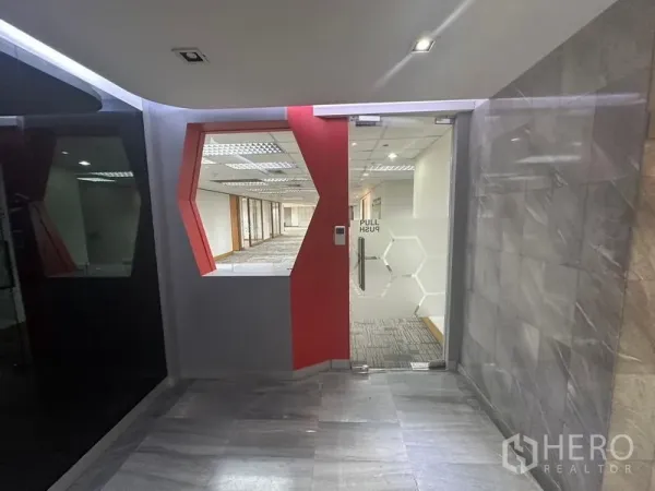 Office Space for rent in Khlong Toei, Bangkok - Main suite entrance with geometric red feature and glass access door.