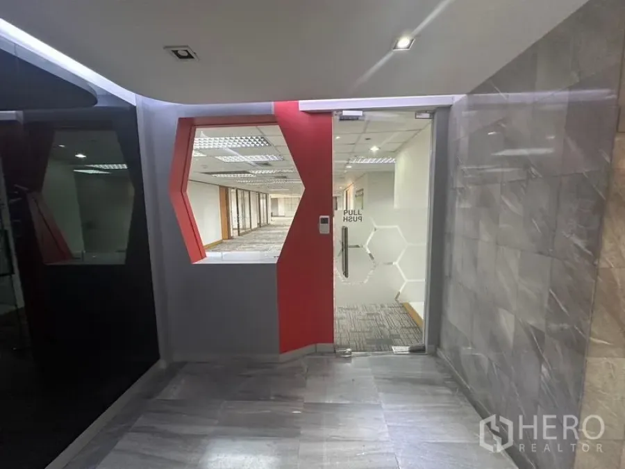 Office Space for rent in Khlong Toei, Bangkok - Main suite entrance with geometric red feature and glass access door.