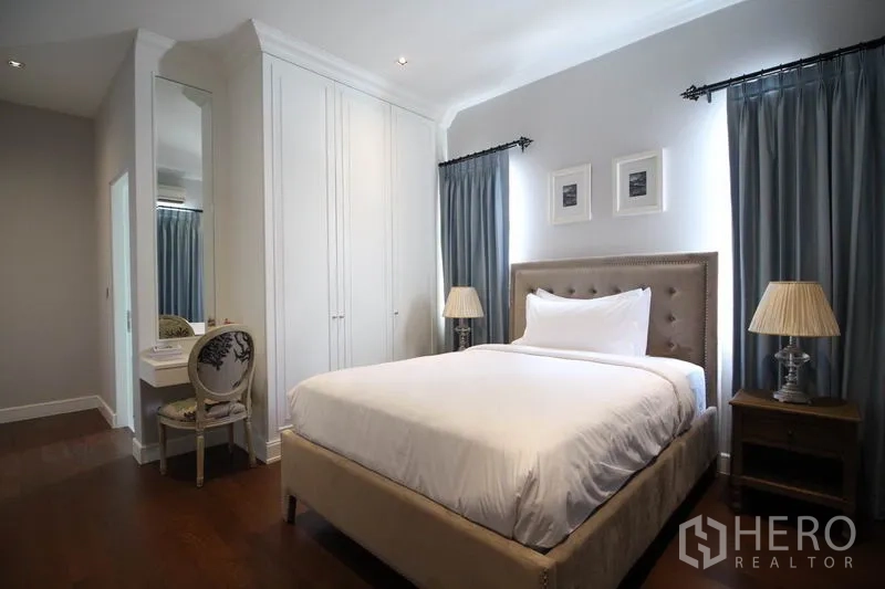 Detached House for rent or sale - Guest bedroom with upholstered bed, bedside tables, dressing corner and soft curtains.