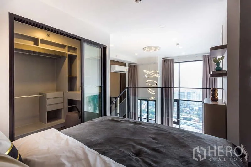 Condominium for rent or sale - Mezzanine bedroom overlooking city views with large built-in closet.