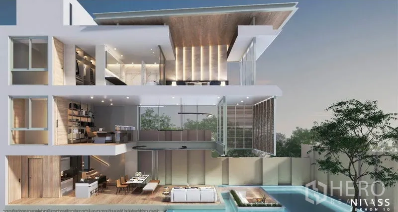 独立式住宅 出售在Lat Phrao, Bangkok - 多层住宅剖视图，可见挑高空间与临池景观。