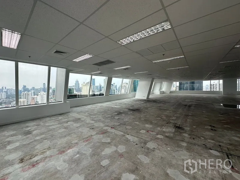 Office Space for rent - Office interior with uninterrupted window band and sweeping cityscape vistas.