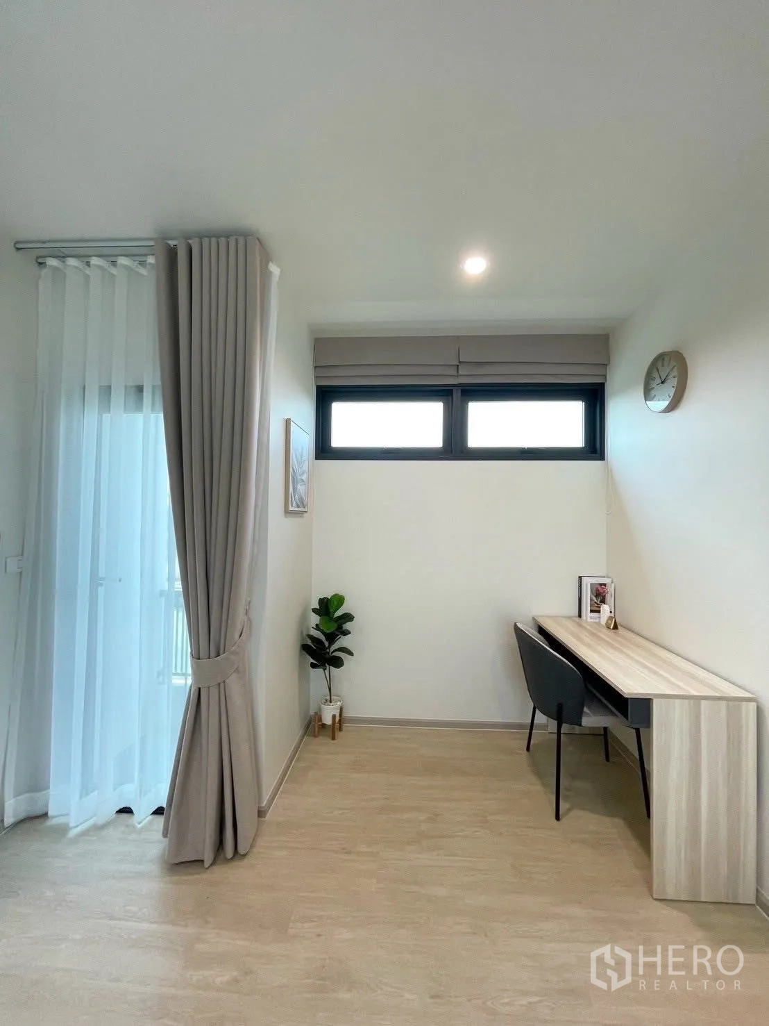 Detached House for rent in Bang Phli, Samut Prakan - Quiet home office nook with long work desk, two chairs, slim high window and balcony curtains.