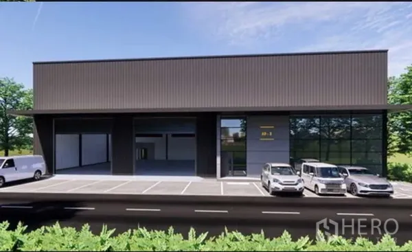 คลังสินค้า ให้เช่าในPak Kret, Nonthaburi - โกดังสไตล์โมเดิร์นสีเข้ม พร้อมประตูม้วนขนถ่าย 3 จุด และลานจอดรถกว้าง