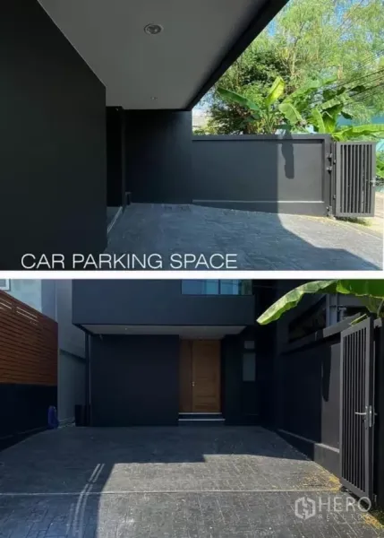 Detached House for rent in Huai Khwang, Bangkok - Gated front yard with covered two‑car parking and paved driveway.