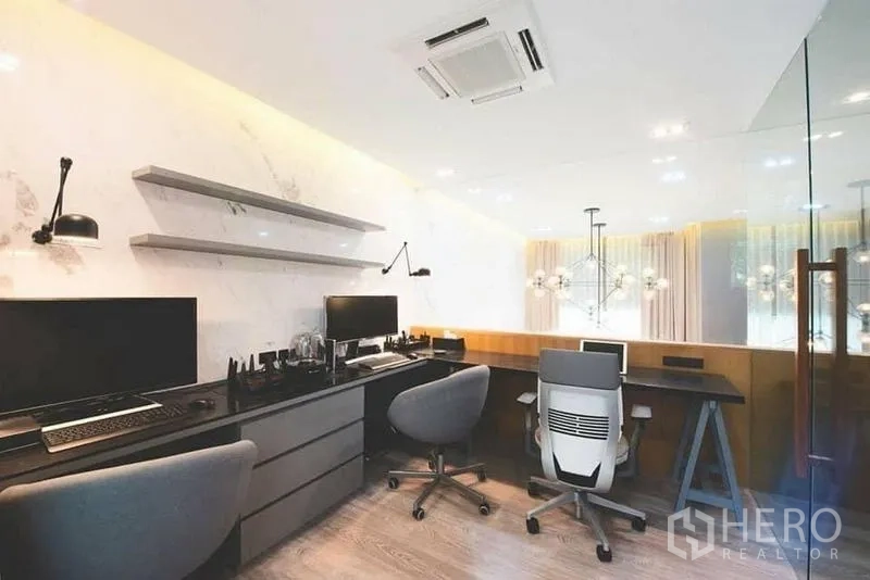 Townhouse for sale in Lak Si, Bangkok - Master suite with bed, built-in sofa, large TV unit, and sheer curtains.