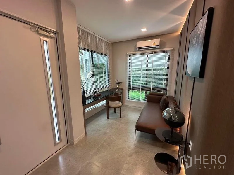 Detached House for rent in Samut Prakan - Quiet study nook with sofa, built-in desk and garden outlook.