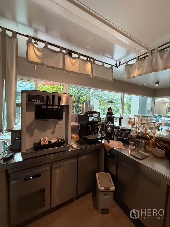 Retail Space for rent in Watthana, Bangkok - Coffee preparation counter with espresso machines and stainless cabinets.