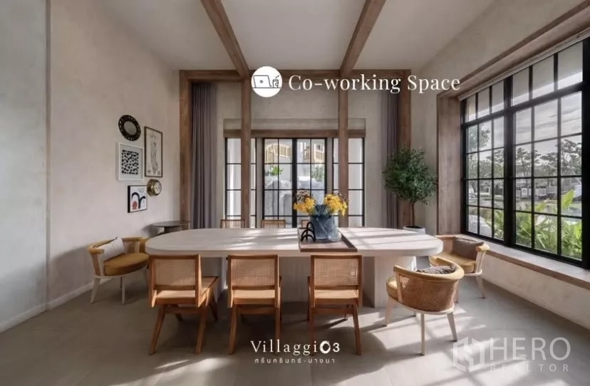 Townhouse for rent in Bang Phli, Samut Prakan - Co‑working space with long table, large windows and warm contemporary decor.