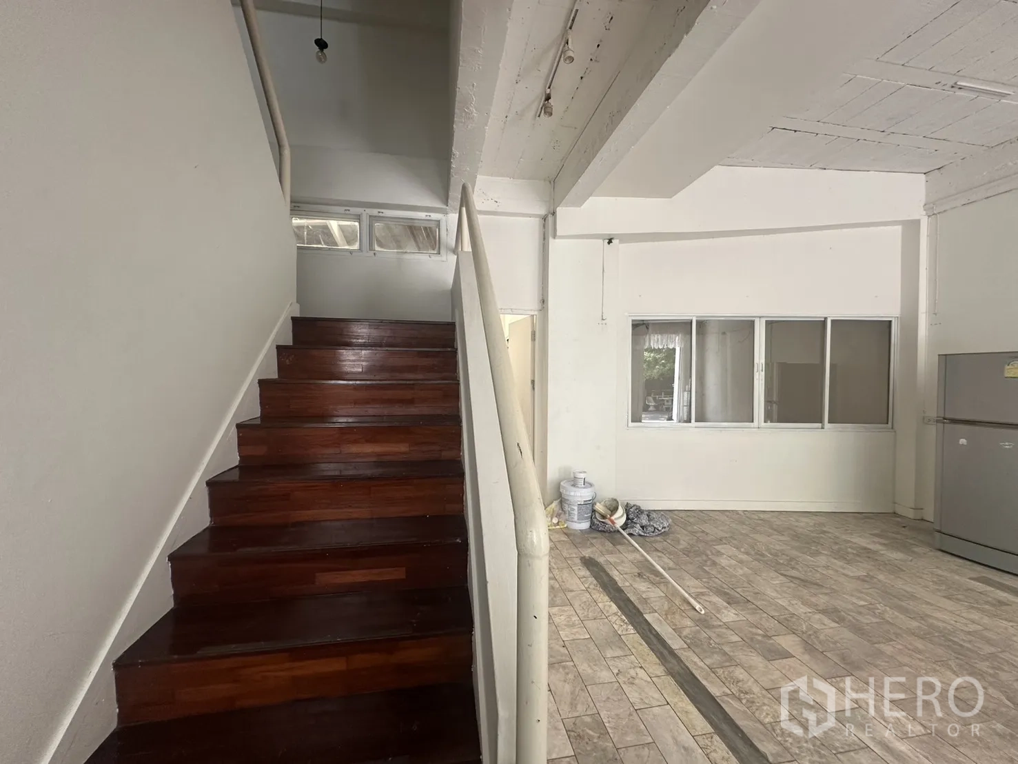 Home Office for rent in Watthana, Bangkok - Wooden staircase leading to the upper floors inside the office.