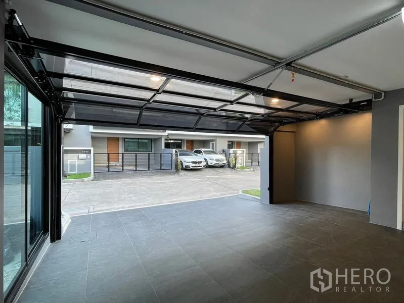 Townhouse for sale - Private covered garage with automatic door opening to a quiet townhouse street.