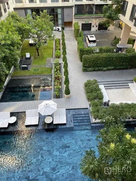 Condominium for rent or sale - Courtyard swimming pool with sun loungers and landscaped garden