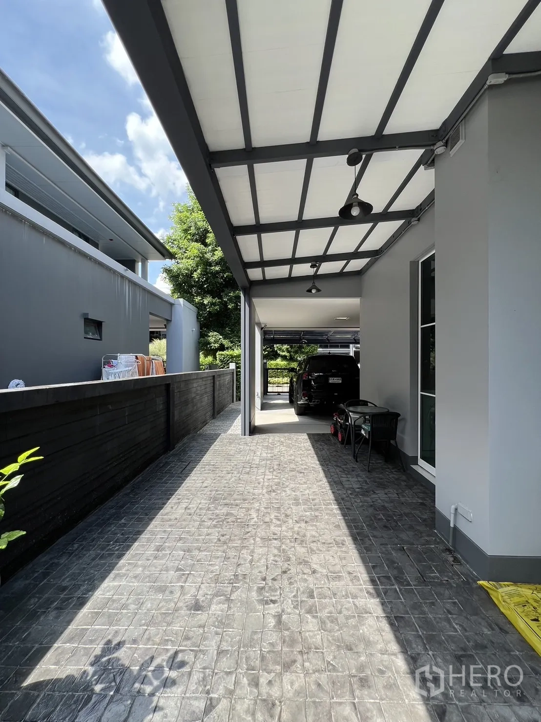 Detached House for rent or sale in Bang Kapi, Bangkok - Small terrace with glass door, bistro set and water filtration system.