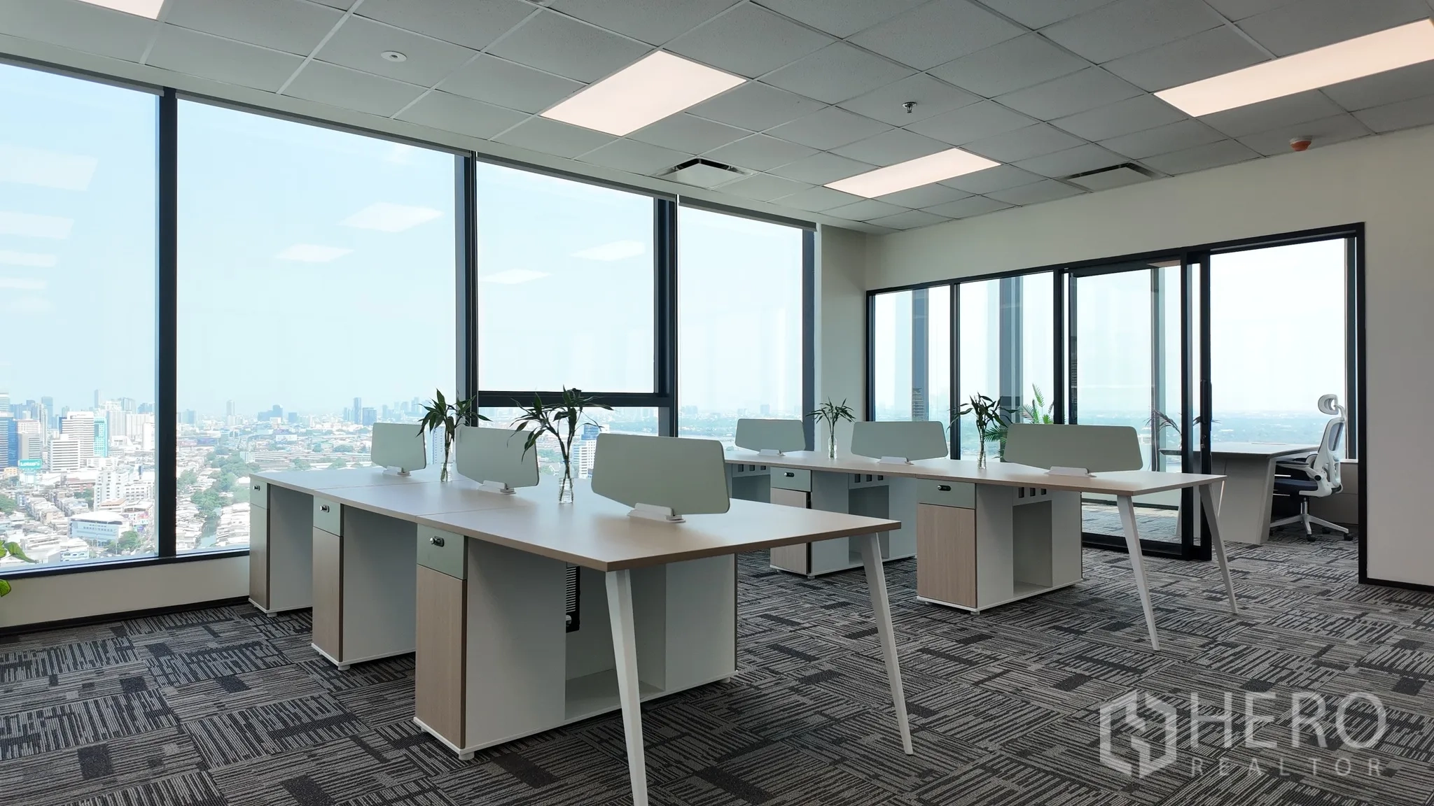 Office Space for rent in Khlong Toei, Bangkok - Bright office zone with modular desks and sliding glass doors to a private room.