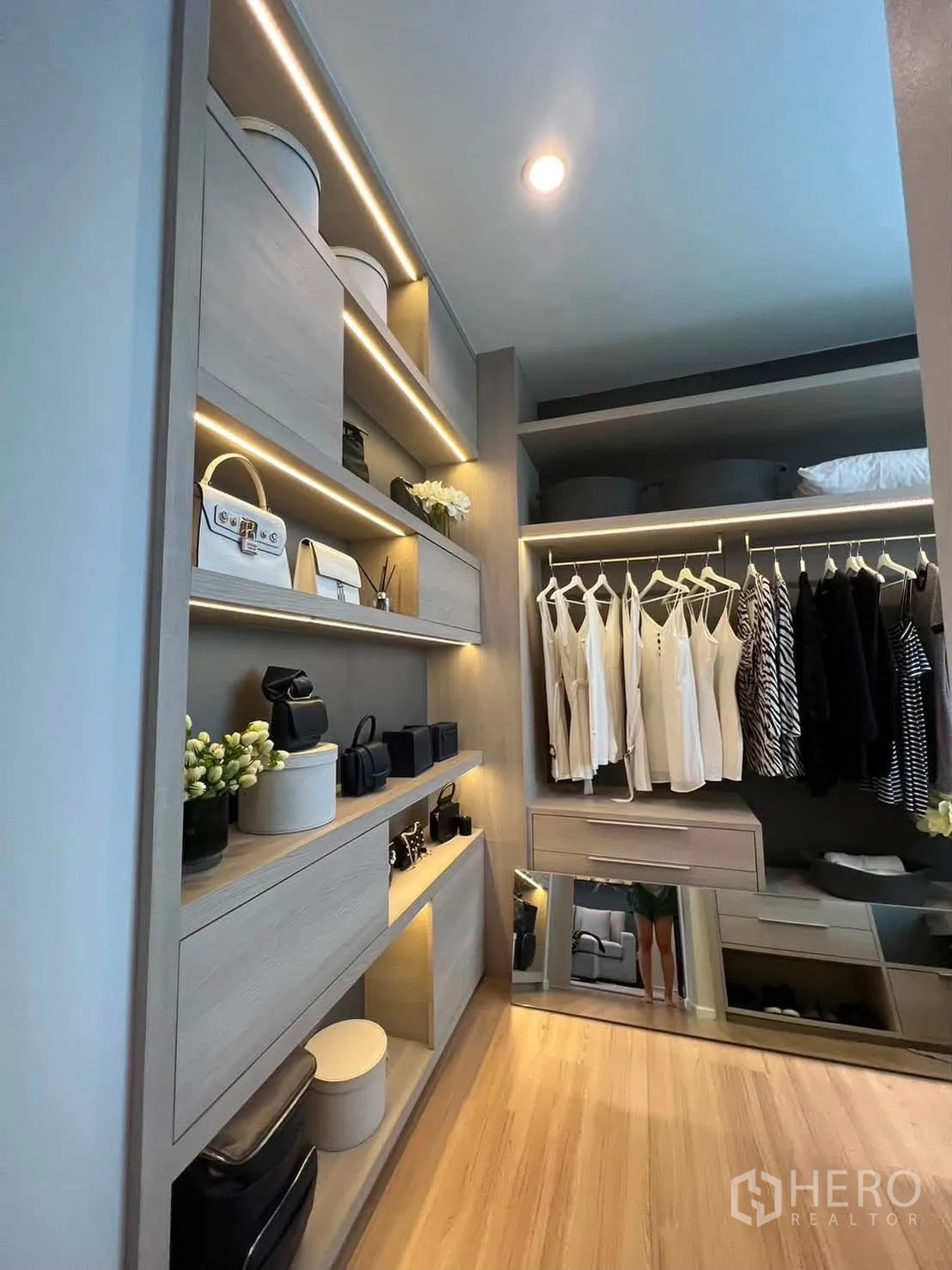 Townhouse for rent in Saphan Sung, Bangkok - Closet storage with illuminated shelves, drawers, and a mirror.