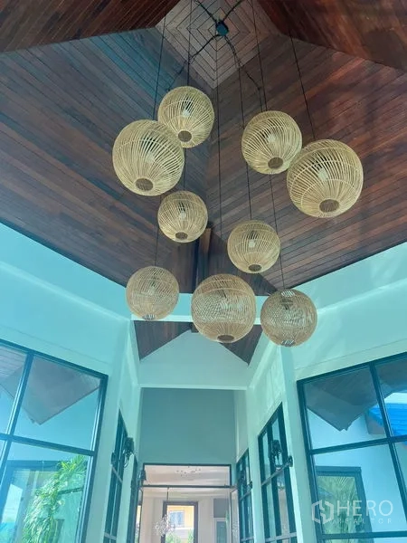 Detached House for sale in Prawet, Bangkok - Double-height foyer with timber ceiling and rattan pendant lights.