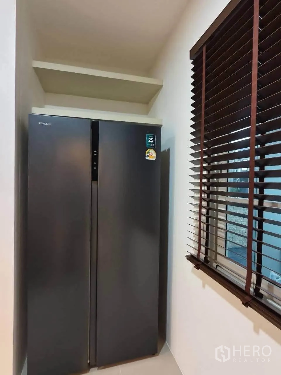 Detached House for rent in Bang Phli, Samut Prakan - Tall double-door refrigerator set in a niche beside window blinds.