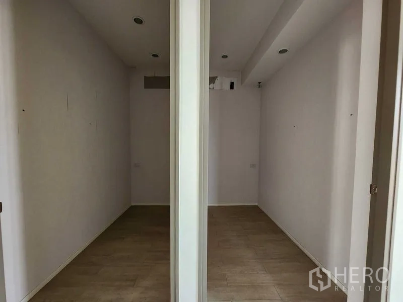 Office Space for rent in Yan Nawa, Bangkok - Two compact partitioned rooms with recessed ceiling lights.