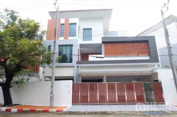 Detached House for sale in Bang Phli, Samut Prakan - Modern three-storey detached house exterior with gated fence and carport.