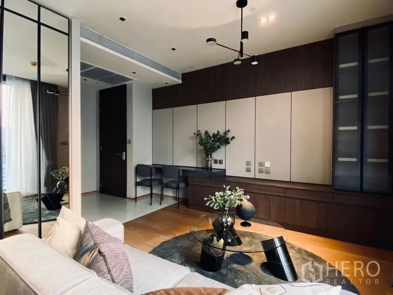 Condominium for sale - Built-in media wall with desk, wood floors and designer lighting in the living room.