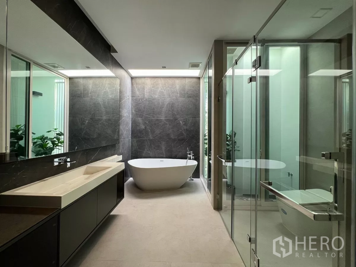 Detached House for sale in Bang Phli, Samut Prakan - Luxury bathroom with freestanding tub, glass shower and long vanity