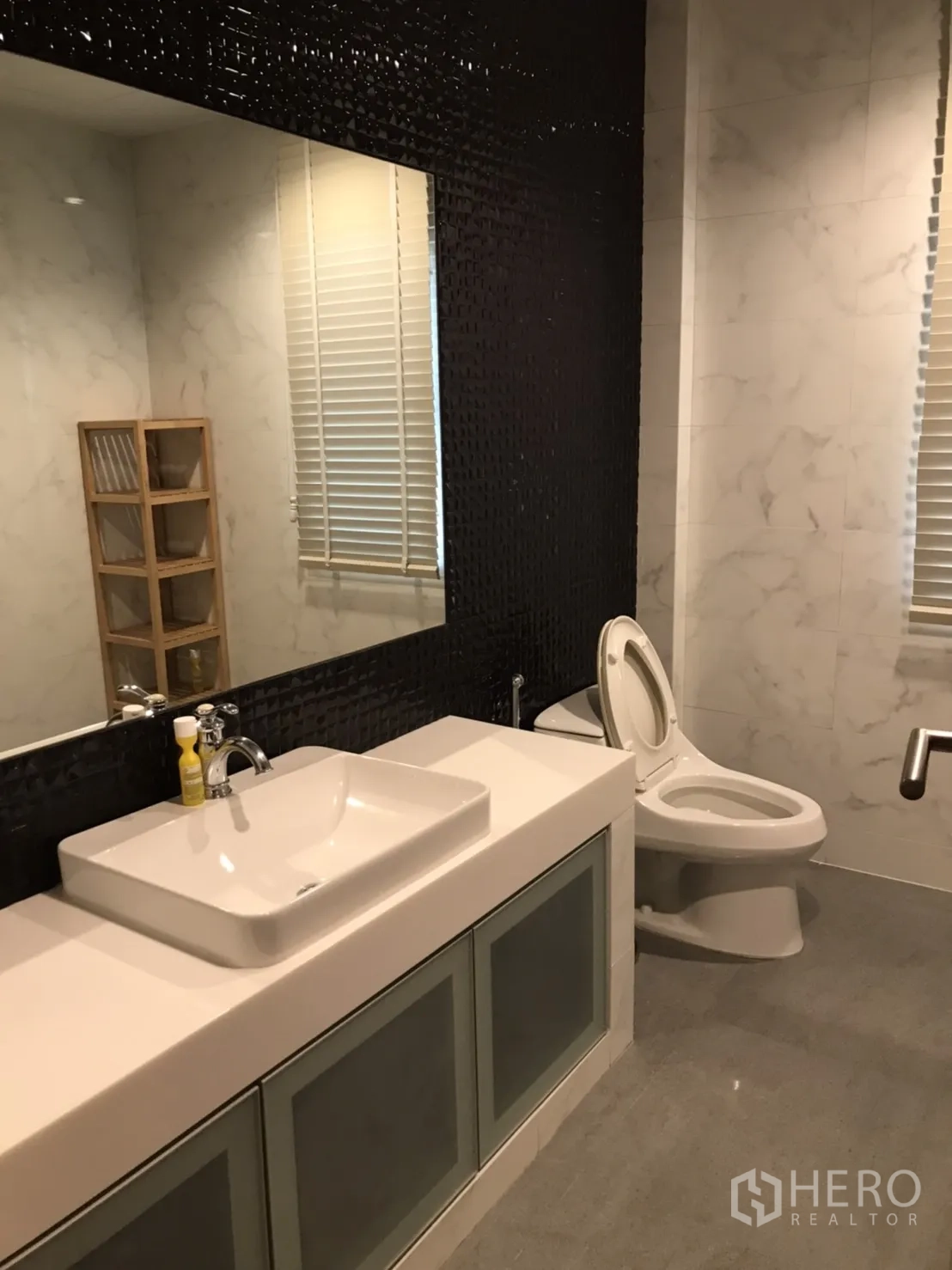 Detached House for rent in Wang Thonglang, Bangkok - Contemporary bathroom with large mirror, vessel sink and storage cabinets