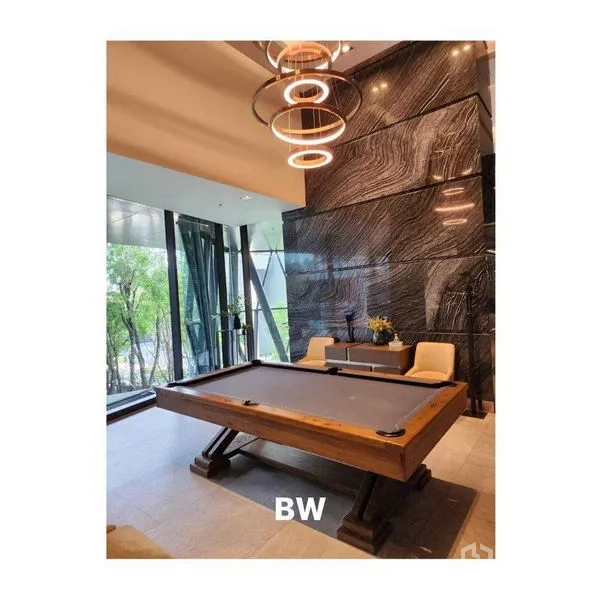 Condominium for rent in Phra Khanong, Bangkok - Stylish billiards room with wooden pool table and designer pendant lights