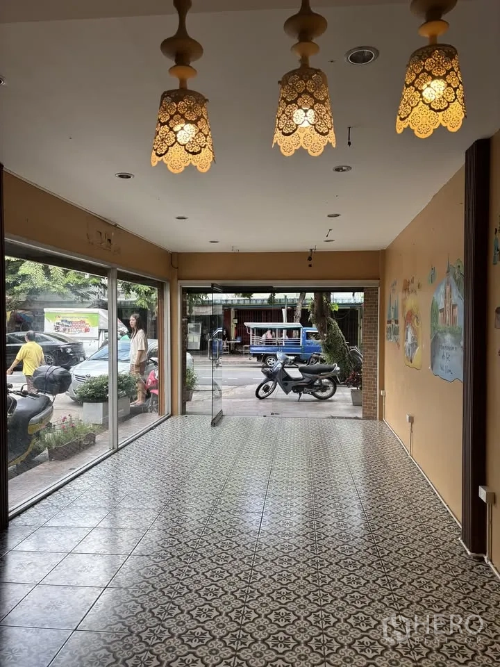 Retail Space for rent in Sathon, Bangkok - Front area with pendant lights and floor-to-ceiling windows facing the street.
