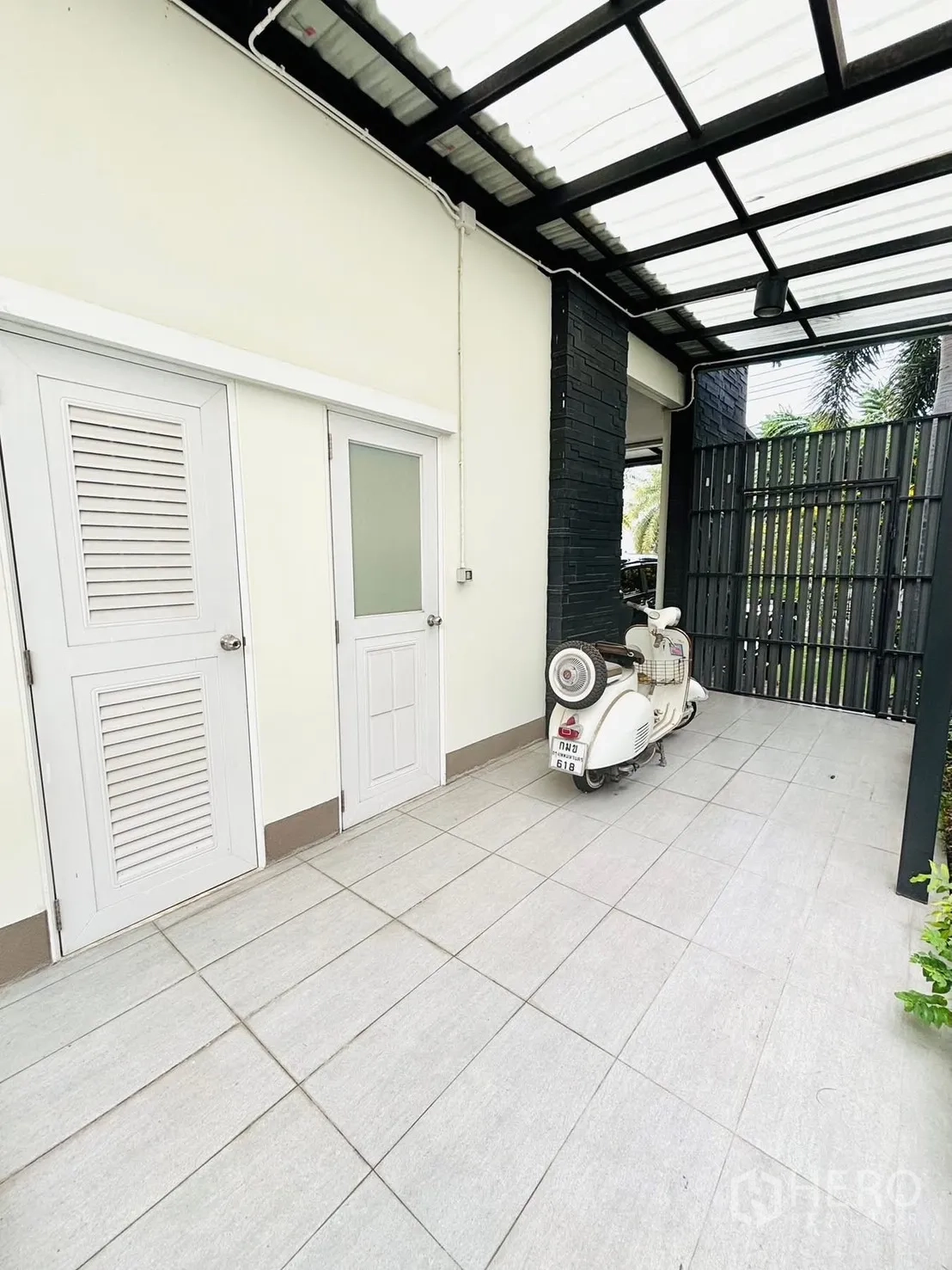 Detached House for rent in Bang Phli, Samut Prakan - Rear patio with canopy, tiled platform and lawn beyond.