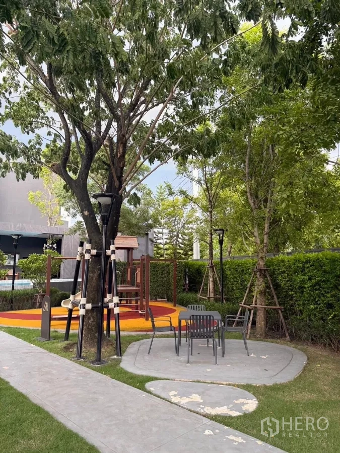 Detached House for rent in Bang Phli, Samut Prakan - Community playground and outdoor seating shaded by mature trees.