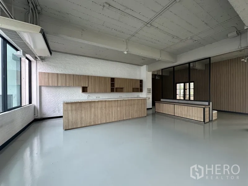 Office Space for rent - Office break zone with wall cabinets, service counter and seating bench.