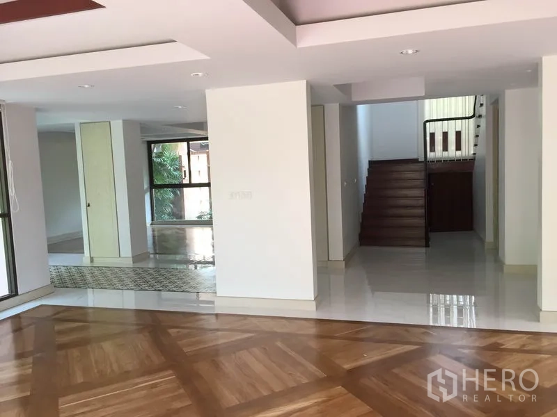 Detached House for rent in Sathon, Bangkok - Spacious ground floor with polished floors and a staircase leading to the upper level