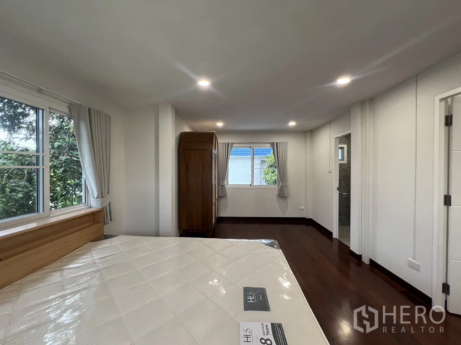 Detached House for rent in Saphan Sung, Bangkok - Master suite view toward ensuite entrance and multiple windows.