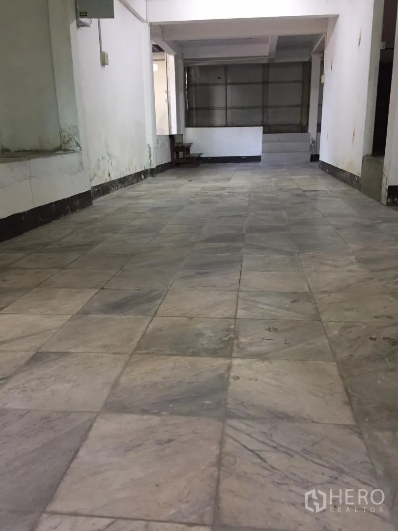 Home Office for rent or sale in Bang Khun Thian, Bangkok - Ground-floor hall with marble tiles suitable for showroom or parking.