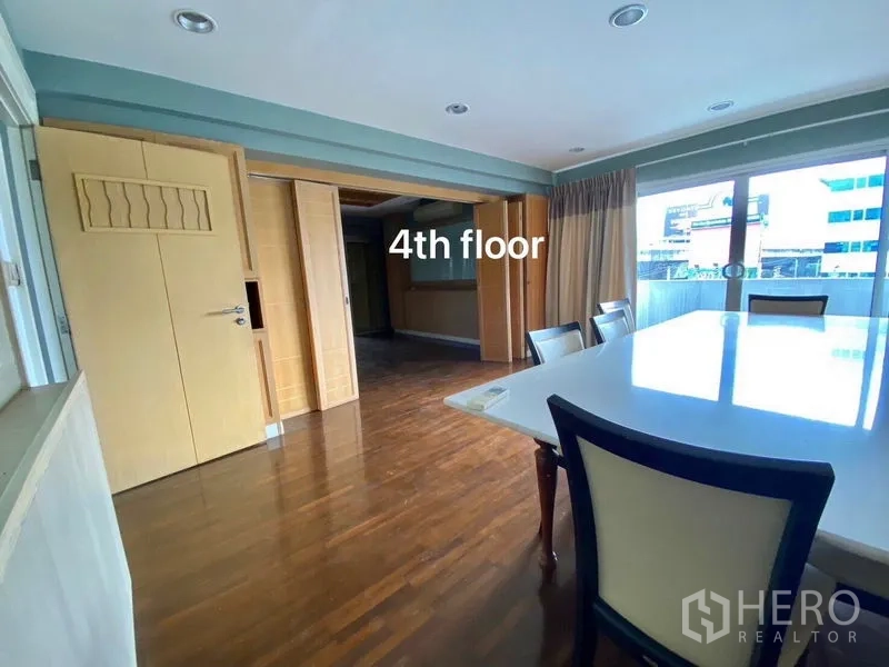 Home Office for rent or sale in Suan Luang, Bangkok - Fourth‑floor meeting room with a large conference table beside wide windows.