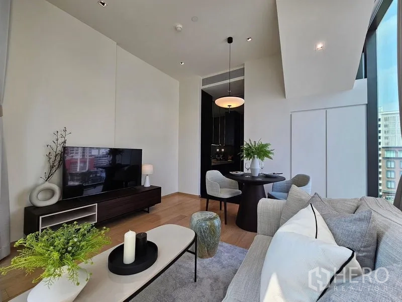 Condominium for rent - Lounge and dining area leading to a dark-toned pantry kitchen.