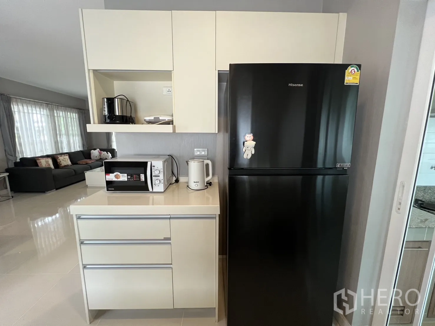 Detached House for rent in Bang Kapi, Bangkok - Pantry zone with built-in drawers and a black refrigerator.