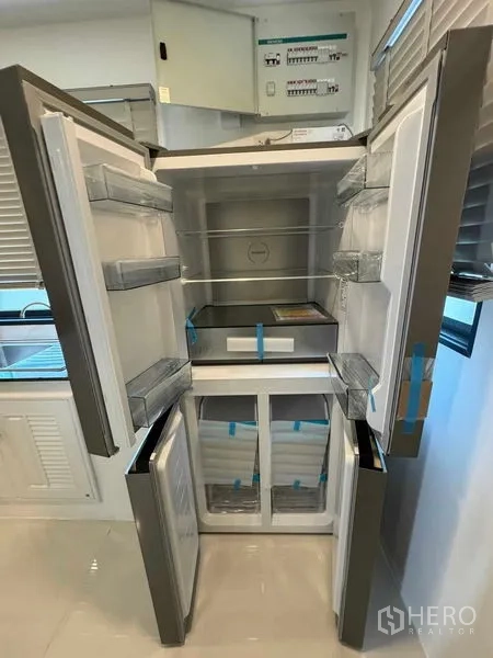 Detached House for rent in Don Mueang, Bangkok - New four-door refrigerator open to show interior compartments.