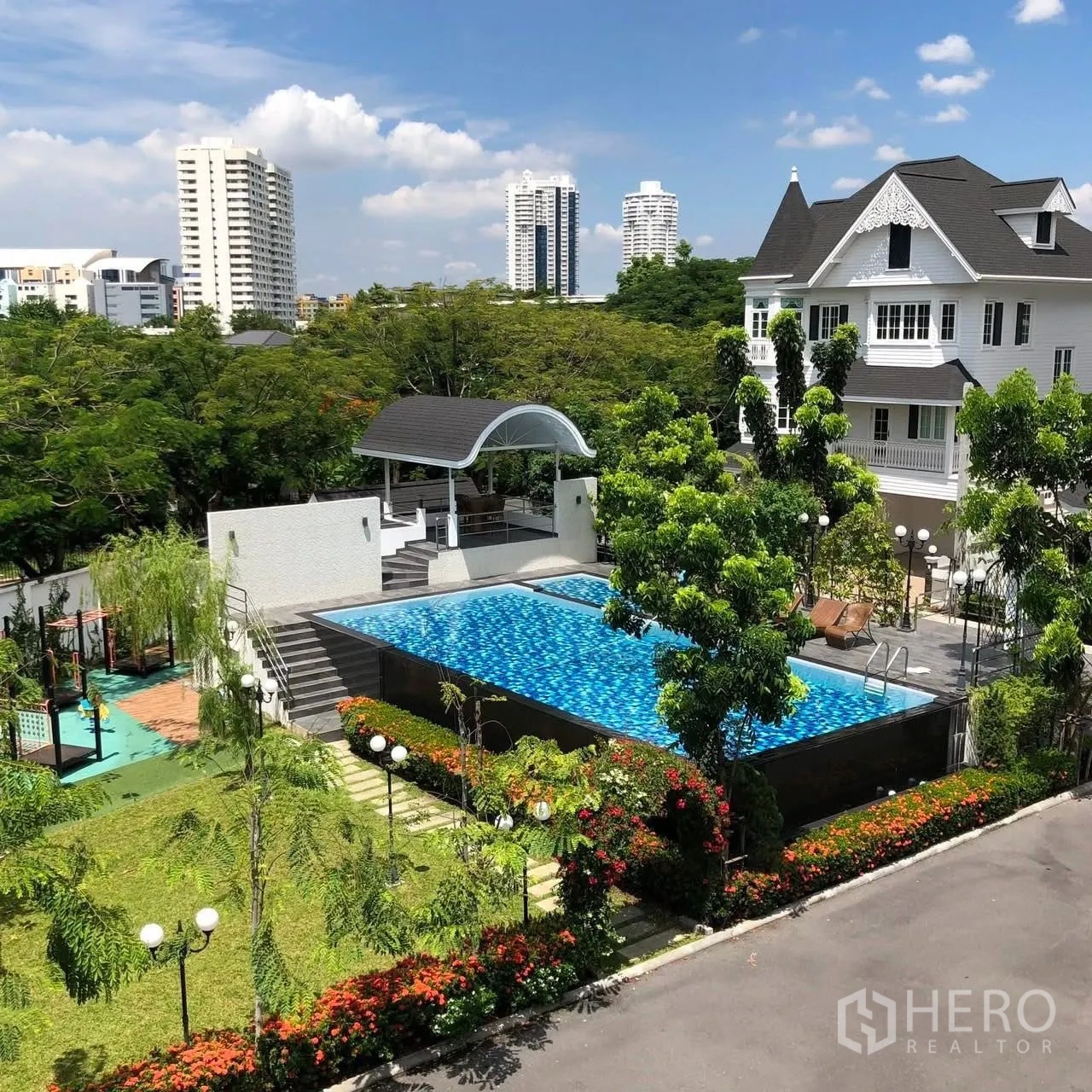 Detached House for rent in Bang Na, Bangkok - Elevated view of swimming pool, pavilion, and landscaped grounds.