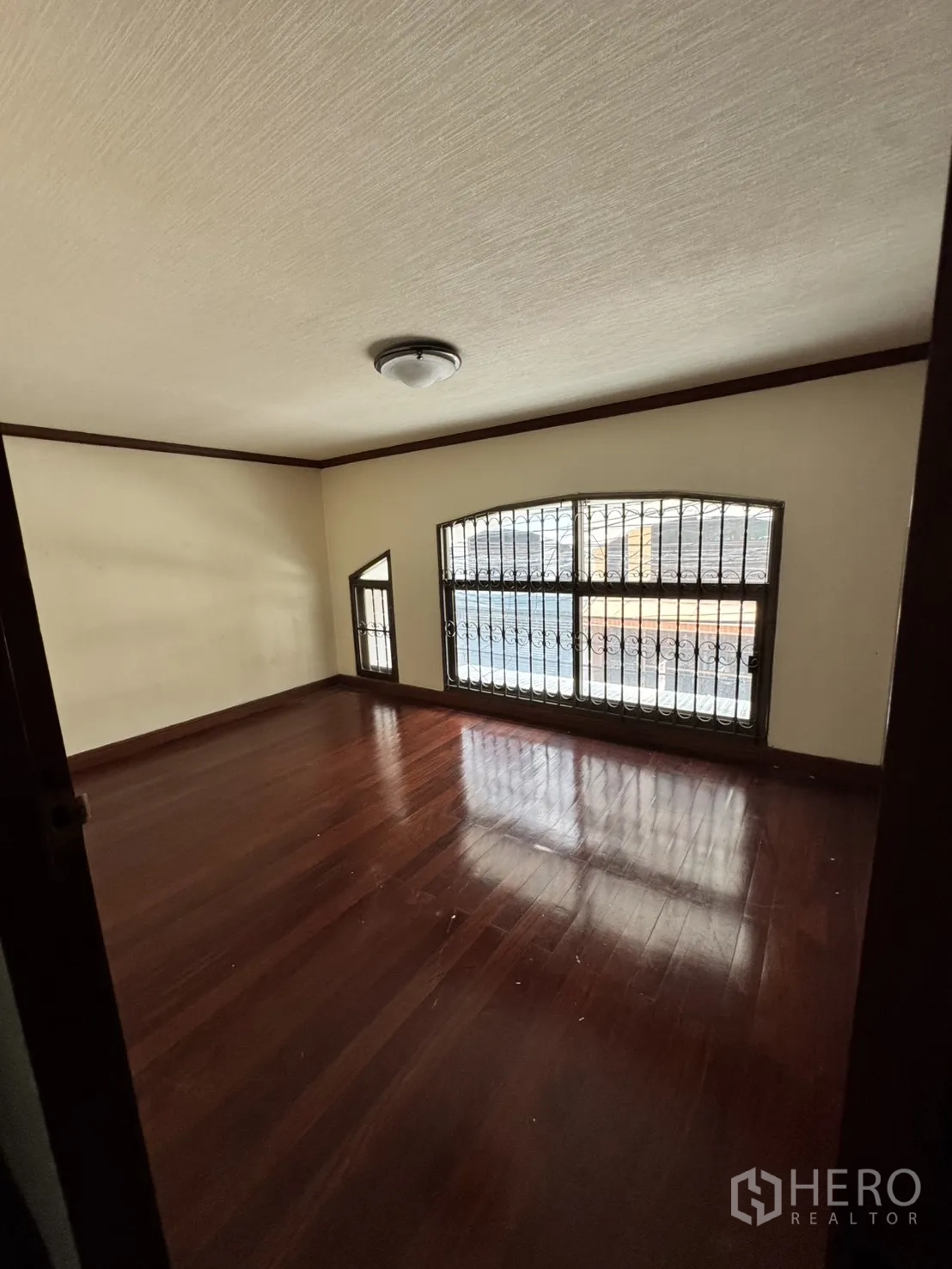 Home Office for rent in Watthana, Bangkok - Expansive coffered-ceiling hall with polished granite flooring and built-ins.