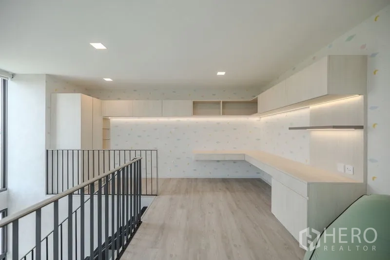 Detached House for rent in Saphan Sung, Bangkok - Mezzanine study area with long built-in worktop, cabinets and railing.