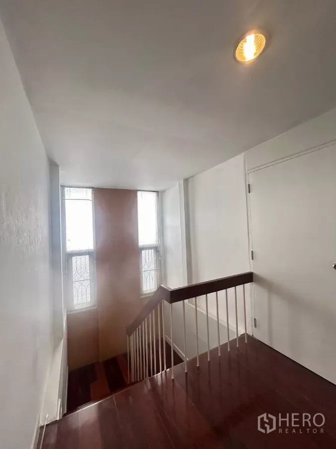 Detached House for rent in Suan Luang, Bangkok - Bathroom with glass shower partition, pedestal sink, and window.