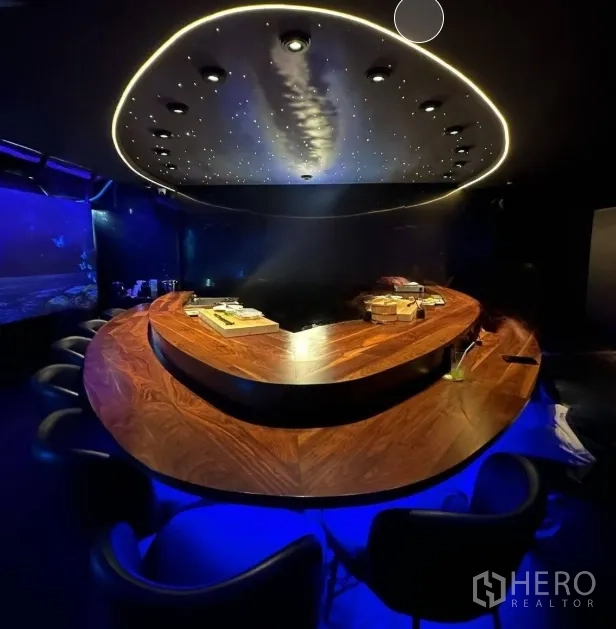 Retail Space for rent in Watthana, Bangkok - Horseshoe bar illuminated in blue with starry oval ceiling feature.