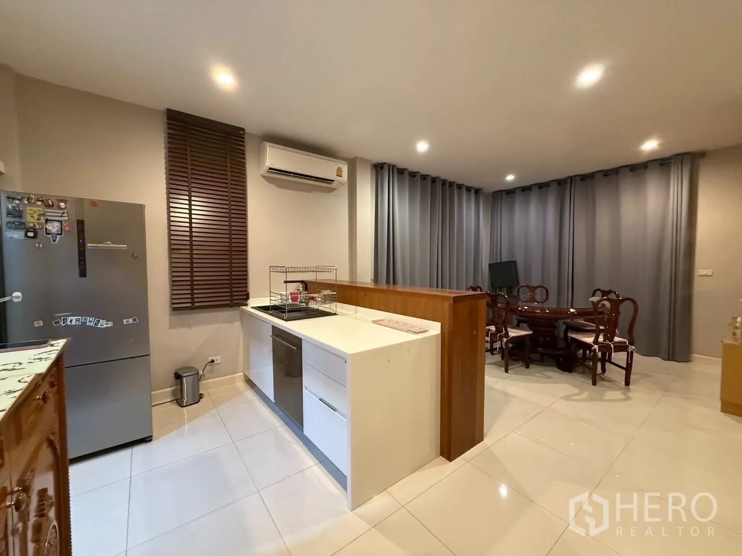 Detached House for rent in Bang Na, Bangkok - Pantry kitchen with island counter, sink, fridge and recessed lighting.