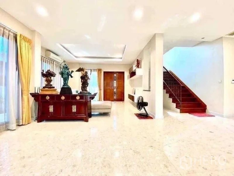 Detached House for sale in Saphan Sung, Bangkok - Spacious foyer and living hall with marble floors, wooden front door and staircase to upper level.