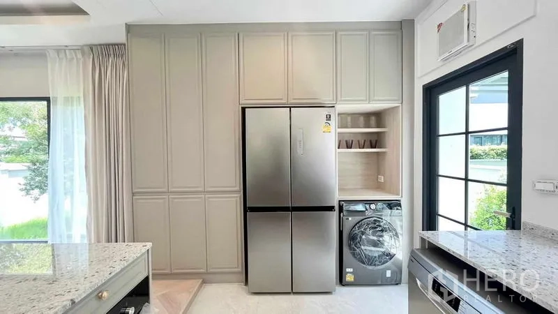 Detached House for rent in Bang Phli, Samut Prakan - Pantry wall with double-door fridge and laundry nook next to the back door