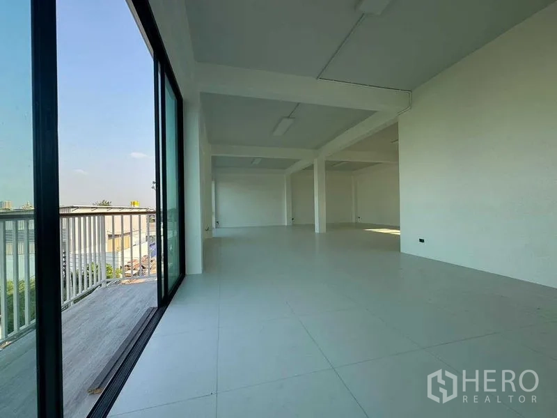 Home Office for rent in Don Mueang, Bangkok - Open office area connected to a balcony via sliding glass doors.